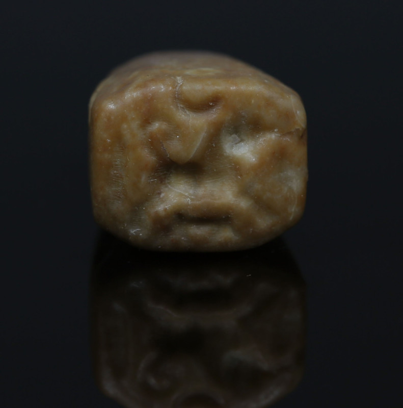 Iron Age, Ammonite stamp seal depicting prancing bull with young, likely a depic...