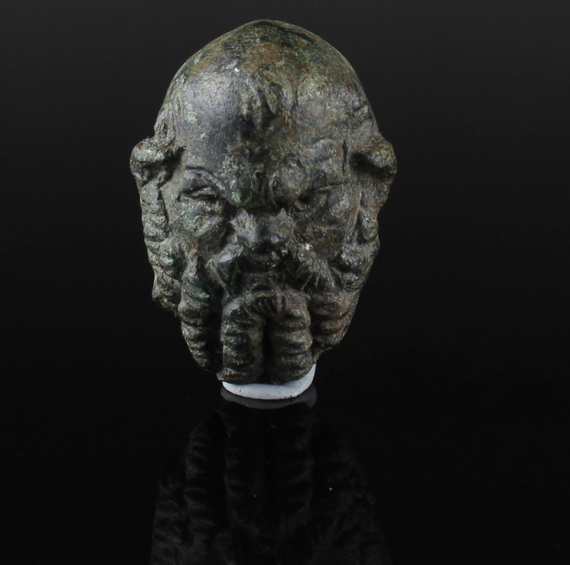 Roman Silenus head applique

ITEM: Silenus head applique
 MATERIAL: Bronze
 ...