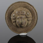 Roman roundel with a female head