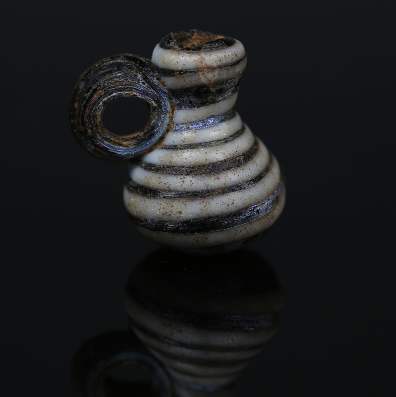 Roman juglet

ITEM: Juglet
 MATERIAL: Glass
 CULTURE: Roman
 PERIOD: 3rd - ...