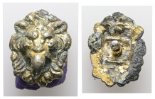 Roman, glazed and gilt bronze applique, with lion head. ca.2nd-4th century AD. 3.35 g. - 20.35 mm.