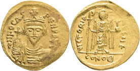 Byzantine. Phocas. Gold Solidus, AD 607-610. Constantinople. Obv: ∂ N FOCAS PЄRP AVC, draped and cuirassed bust facing, holding globus cruciger and we...