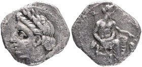 CILICIA. Uncertain. (4th century BC).AR obol. Obv: Laureate head of Apollo(?) left. Rev: Baaltars seated right, holding lotus-tipped scepter in right ...