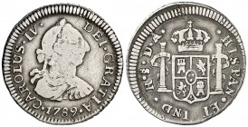 1789. Carlos IV. Santiago. DA. 1/2 real. (Cal. 1333). 1,70 g. Busto de Carlos III. Ordinal IV. Rara. BC/BC+.