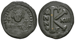 JUSTINIAN I (527-565). Half Follis. Constantinople.
Obv: D N IVSTINIANVS P P AVG.
Helmeted and cuirassed bust facing, holding globus cruciger and deco...