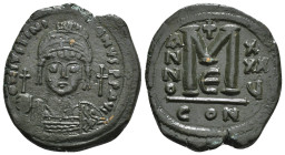 Justinian I (544/5 AD) Constantinople, AE Nummi 
Obv: D N IVSTINIANVS P P AVC, helmeted and cuirassed bust facing, holding globus cruciger and shield;...