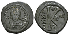 Justinian I, AD 527-565. AE, Half Follis. Theoupolis (Antioch).
Obv: D N IVSTINI-ANVS P P AVG. Helmeted and cuirassed bust of Justinian I facing, hold...