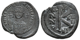 Justinian I (527-565 AD). Nicomedia. dated RY 30 = 556/7
AE Half Follis
Obv: Helmeted and cuirassed bust facing, holding globus cruciger and shield de...