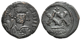 TIBERIUS II CONSTANTINE (578-582). Half Follis. Nicomedia.
Obv: D m TIB CONSTANT P P AVG.
Helmeted, draped and cuirassed bust facing, holding globus c...