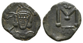 TIBERIUS III APSIMAR (698-705). Follis. Syracuse.
Obv: Crowned, draped and cuirassed bust facing, holding shield and spear; star to left.
Rev: Large M...