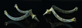 Rare 11th C. Medieval Bronze Prick Spur

With dragon carvings and ornamental details on the sides. These carvings are decorated with gold and blue/t...