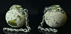 Aryballos with chain. 1st - 2nd century AD. Green clear glass. Round body with flattened base, wide cylindrical neck and folded, flattened lip. Two ma...