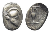 ASIA MINOR, Uncertain AR Tetartemorion, (7mm, 0,17 g) ca 450 BC Corinthian helmet right Rev: Amphora within beaded rectangular frame.