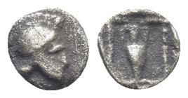 Asia Minor, Uncertain. AR Tetartemorion. (6mm, 0,21 g). 5th century BC. Obv: Crested helmet right Rev: Amphora; pellets flaking base; all within incus...