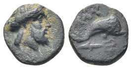 CARIA. Myndos. Ae (11mm, 1.0 g) (386-300 BC). Obv: Laureate head of Poseidon right. Rev: MY. Dolphin swimming right; below, trident right.
