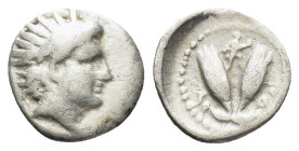 CARIA. Rhodes.(Circa 275-250 BC).Diobol. (0.91 Gr. 10mm.)
Radiate head of Helios right.
 Rev. P - O. Flanking two rose buds, running Artemis between b...