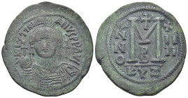 Justinian I AD 527-565. Dated RY 14=540/1 AD. Cyzicus Follis or 40 Nummi (23.42 Gr. 41mm.)
Helmeted and cuirassed bust facing, holding globus cruciger...