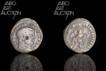 Roman coin Billon - Empire - Diocletian Follis Ticinum 300-303

IMP C DIOCLETIANVS PF AVG Laureate head right. Rev: SACRA MONET AVGG AND CAESS NOSTR...