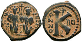 JUSTINO II y SOFIA. 1/2 Follis. (Ae. 6,42g/24mm). 569 d.C. Theoupolis (Antioquía). (DOC 169). Anv: Justino y Sofía sendentes de frente portando cetro ...