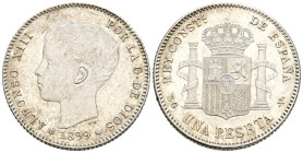 ALFONSO XIII (1885-1931). 1 Peseta. (Ar. 5,15g/23mm). 1899 *18-__. Madrid SGV. (Cal-2019-57). SC-. Segunda estrella no visible. Aun así, muy raro en e...