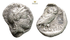 Attica, Athens AR Obol. Circa 510-500/490 BC. (0.56g. 8.8mm 3h.) Helmeted head of Athena right / Owl standing left, head facing; olive-sprig behind; a...
