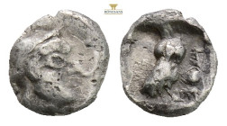 Attica, Athens AR Obol. Circa 510-500/490 BC. (0.36g. 707mm 3h.) Helmeted head of Athena right / Owl standing left, head facing; olive-sprig behind. B...