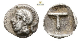 Arkadia, Tegea AR Tetartemorion. Circa 423-400 BC. (0.17g, 6.12 5h.) Head of Athena Alea to left, wearing crested Attic helmet / Large T within shallo...