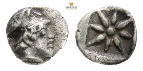 Troas, Kolone AR Hemiobol. Circa 4th century BC. (0.40g, 6.6mm 6h.)Helmeted head of Athena to right / Stellate pattern in linear square; all within in...