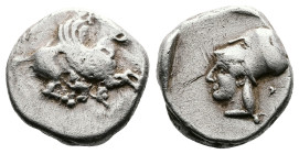 Corinthia. Corinth, circa 480-450 BC. AR Stater (19.3 mm, 8.39 g). Ϙ, Pegasos with curled wing flying right. Rev. Helmeted head of Athena to left with...