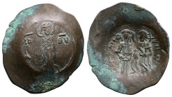 Andronicus I, 1183-1185. Billon Trachy. ( 28,5 mm. 4.14 g). Constantinople. MTΡ-ΘV across fields, Mary standing facing on dais, nimbate, holding the n...