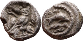 Phoenicia: Tyre ( IV century BC) Obol Obverse: Hippocamp right; waves and dolphin below. Reverse: Owl standing right, head facing; crook and flail dia...
