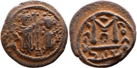 al-Malik ibn Marwan (687-705), Byzantine style folis Obverse: Two standing figures Reverse: Large M and inscription

20mm 4,42g

Artificial sand p...