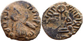 al-Malik ibn Marwan (687-705) Follis. Obverse: Standing caliph Reverse: Modified cross potent set on steps

17mm 3,08g