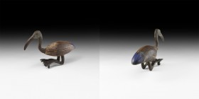 Egyptian Ibis Figure
Late Period-Ptolemaic Period, 664-30 BC. A recumbent ibis with carved ovoid wooden body with lateral folded wings, applied pigme...