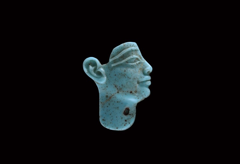 Egyptian Turquoise Glass Face Inlay
Ptolemaic Period, 3rd-1st century BC. A tur...