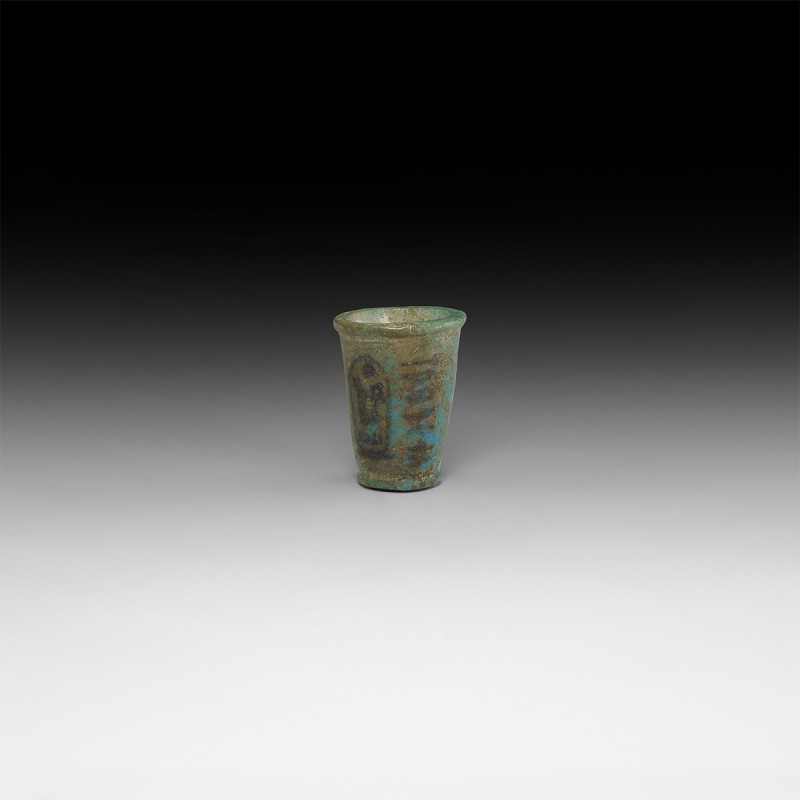 Egyptian Seti I Offering Cup
19th Dynasty, 1282-1226 BC. A blue glazed composit...