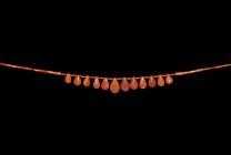 Egyptian Carnelian Pendant Necklace
New Kingdom, 18th Dynasty, 1549-1292 BC. A restrung necklace of graduated carnelian tubular beads and spacer bead...