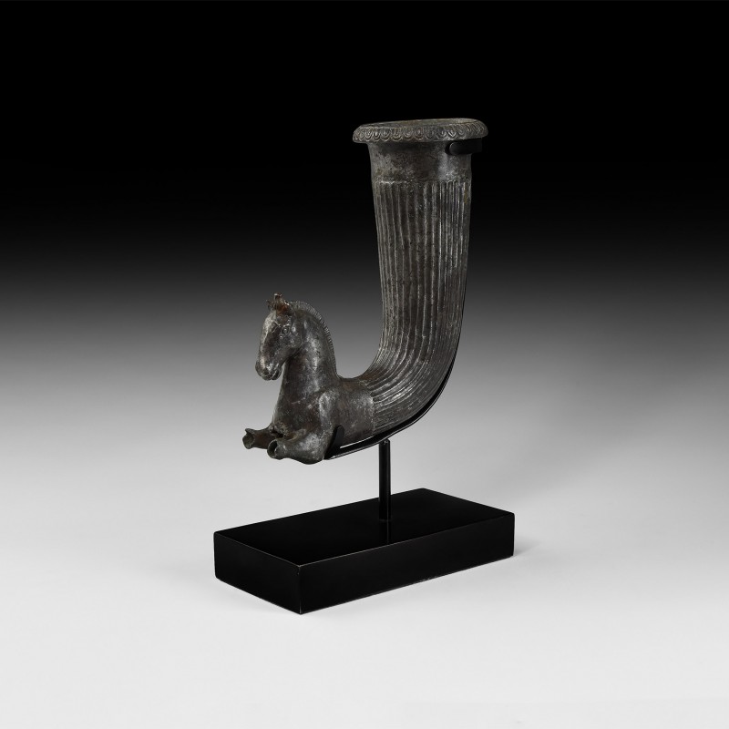 Greek Silver Horse Rhyton
4th century BC. A silver rhyton comprising a fluted t...