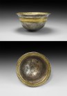 Greek Gilt Silver Palm Cup
5th-3rd century BC. A parcel-gilt silver palm cup with hemispherical bowl, flared rim gilt band to the outer face with fra...