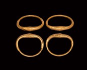 Parthian Gold Bracelet Pair
1st-2nd century AD. A matching pair of hollow-form gold bracelets, round-section hoop with biconical bulb to the upper pa...