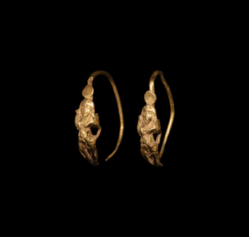 Greek Gold Astarte Earrings
5th century BC. A matched pair of gold figural earr...