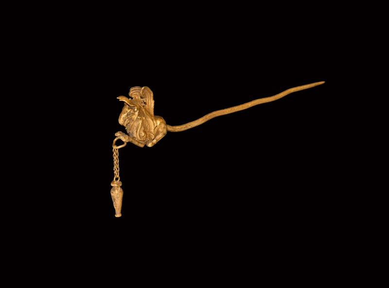 Greek Gold Pin with Gryphon
5th century BC. A gold dress pin with tapering roun...