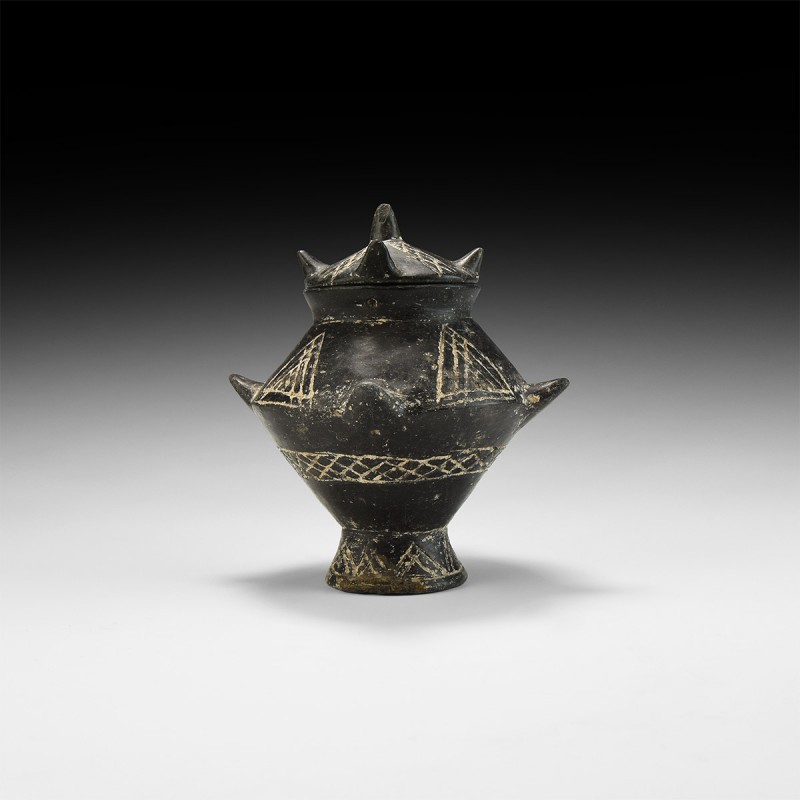 Etruscan Lidded Vessel
8th-3rd century BC. A ceramic blackware lidded jar compr...