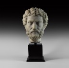 Roman Marble Head of Antoninus Pius
2nd century AD. The head of Emperor Antoninus Pius captured in marble; the stern features framed by a full head o...