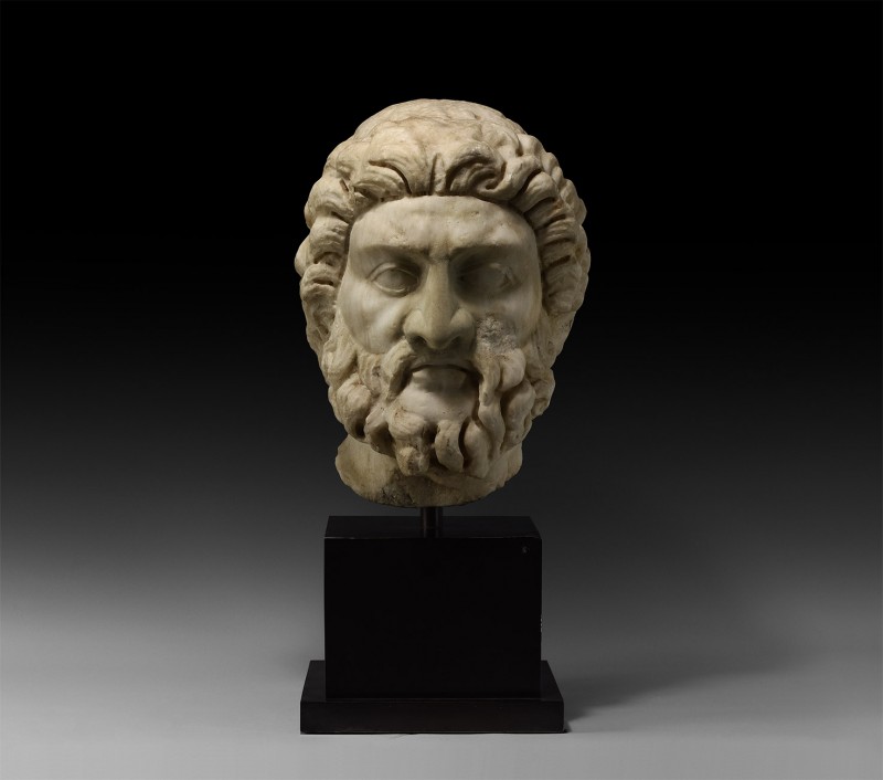 Large Roman Head of Asclepius, God of Medicine
1st-2nd century AD. A monumental...
