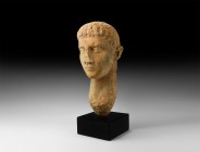 Roman Head of a Man
1st-2nd century AD. A life-size marble portrait head of a nobleman with finely modelled features, thin lips, simply carved almond...