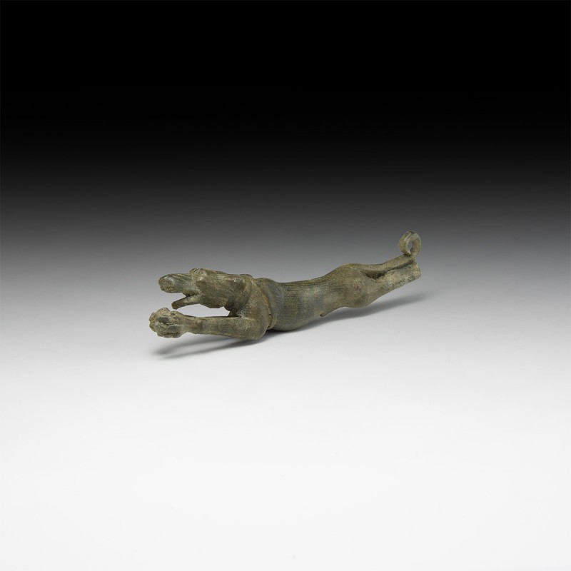 Roman Leaping Hound Figure
1st-2nd century AD. A bronze figure fragment of a le...