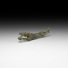Roman Leaping Hound Figure
1st-2nd century AD. A bronze figure fragment of a leaping hound with forepaws extended, harness to the shoulders, tail fla...
