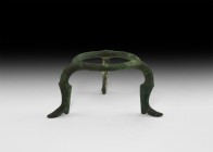 Roman Footed Tripod Stand
1st-2nd century AD. A bronze tripod vessel stand comprising a circular base with raised median band; three radiating legs f...