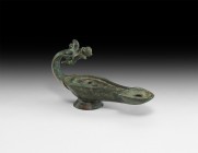 Roman Oil Lamp with Panther Handle
2nd century AD. A bronze oil lamp with piriform body and D-shaped nozzle, conical base, handle formed as a D-secti...